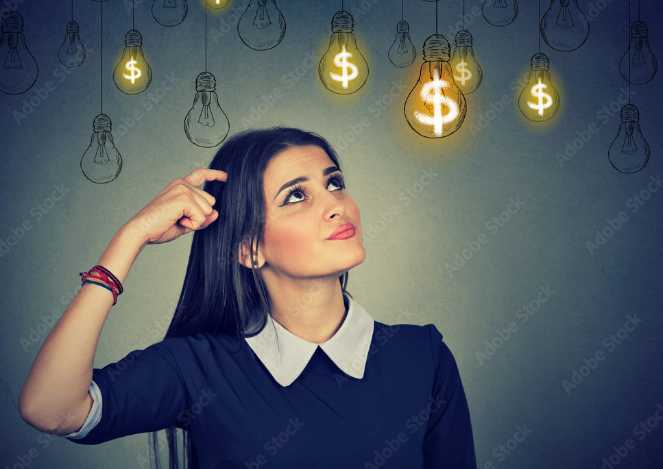 Thinking young woman looking up at dollar idea light bulbs above head